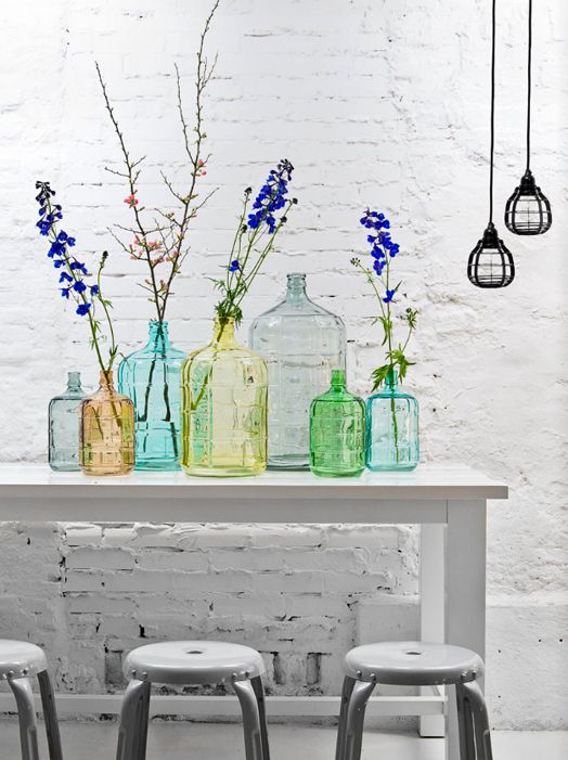 This colorful grouping of colored glass jugs is a simple example of how together, the objects have a dramatic impact that individual pieces alone wouldn't have. 