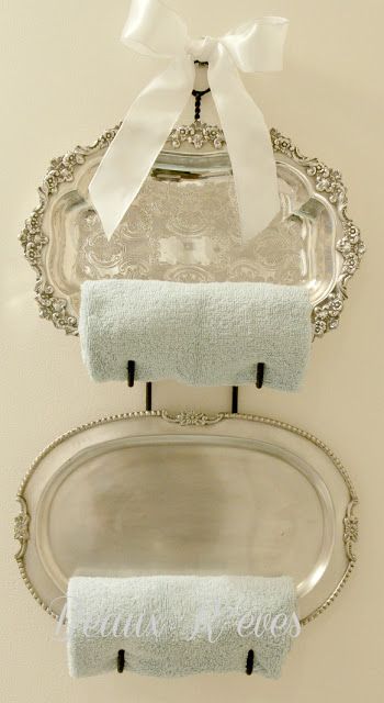 Add to the accessories by repurposing those silver trays in a dining room drawer as towel racks.