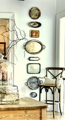 This collection of vintage silver trays provides unique yet personal wall decor.