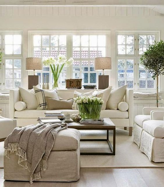 Even in neutrals, rugs can add comfort, warmth, and a relaxed elegance to a room.