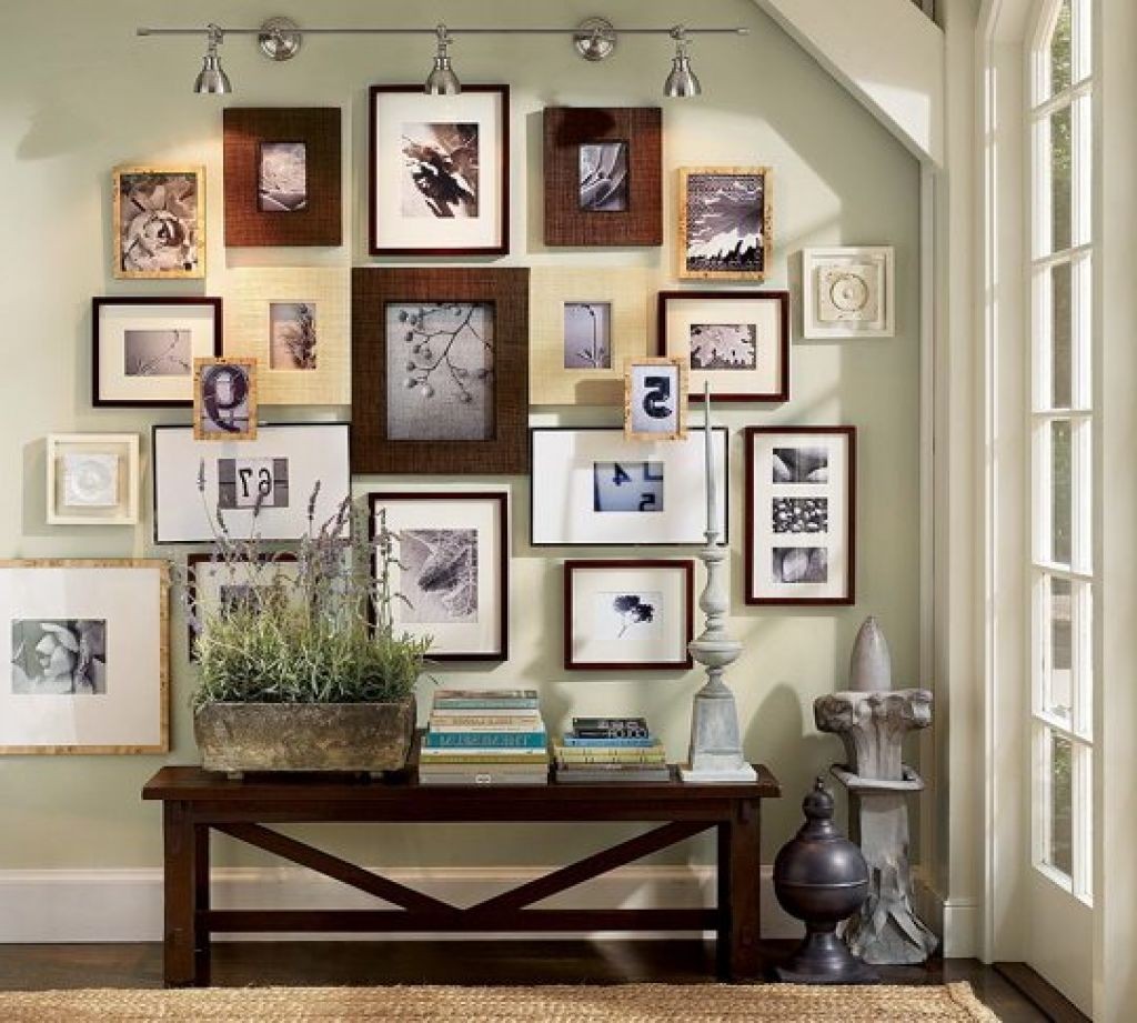 I love the variety of sizes and shapes used here, yet the wooden frames and pictures keep the cohesive.