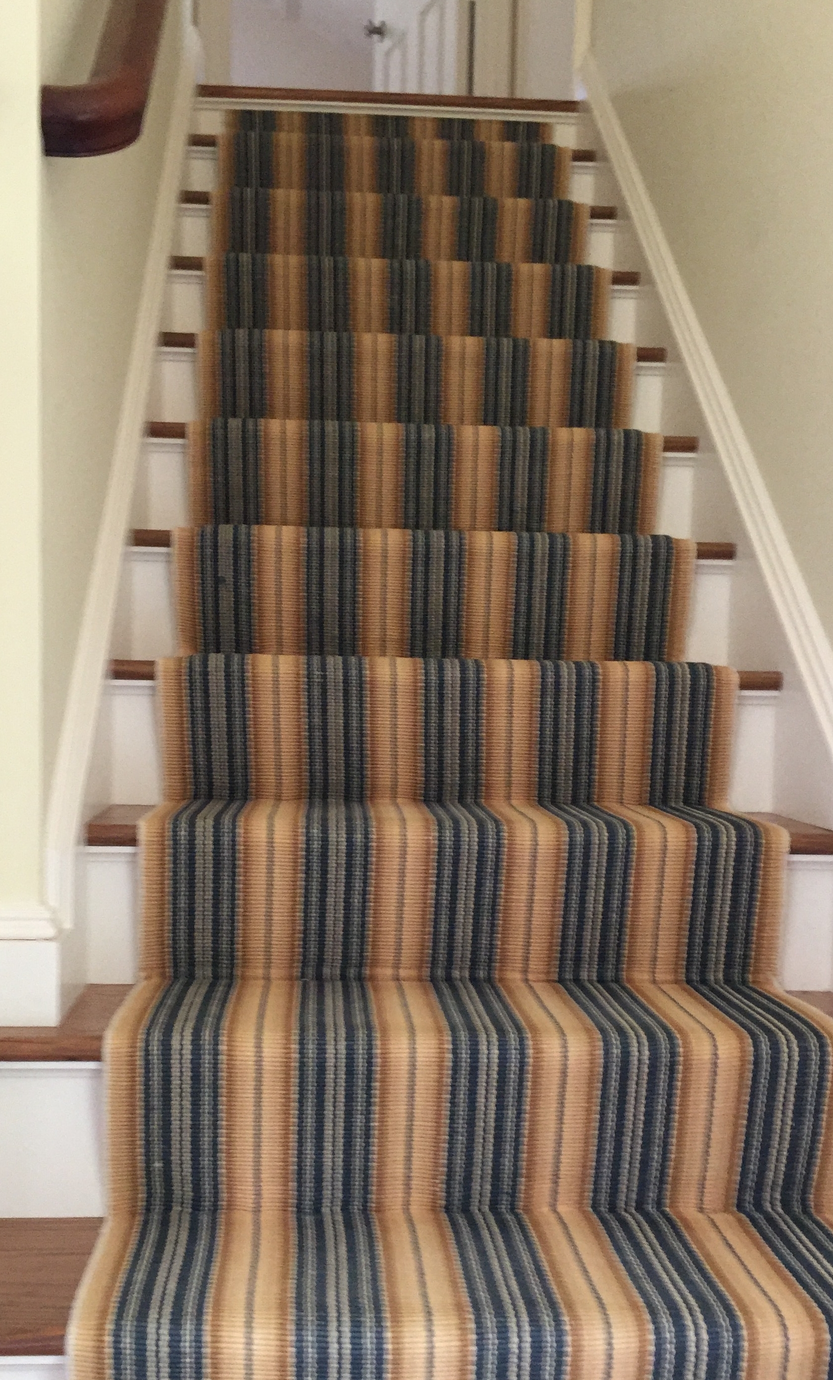 This cotton runner from Dash and Albert was a great way to liven up the stairwell. We ordered 2 8' runners and had our installer run them up the stairs ending just below the top landing.