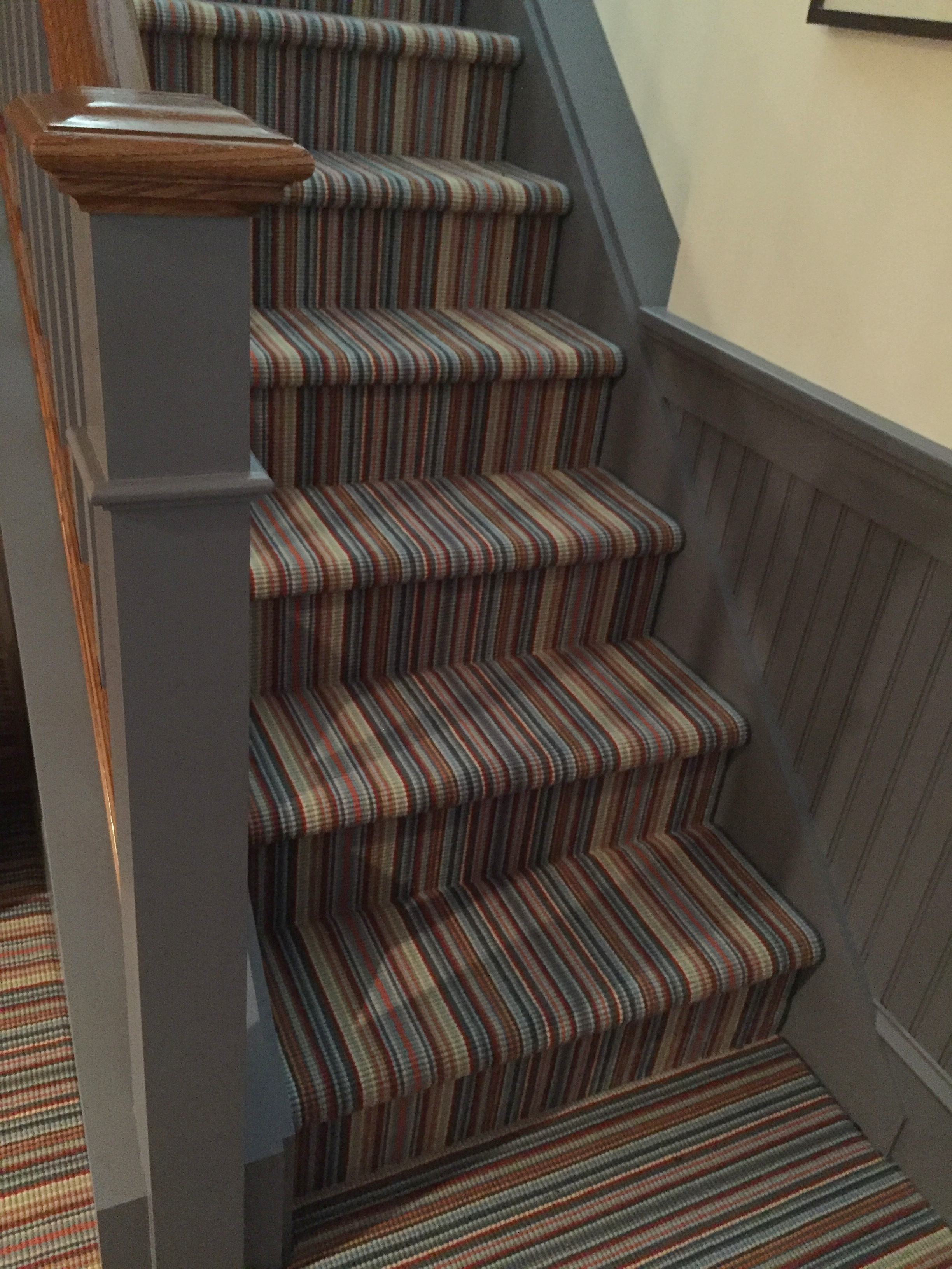 We like this Weave Tuft carpet, too. It is the same style and colorway as the first image in this blog! See how different it can look in this application? These are "carpet grade" stairs (for the budget conscious) so the carpet is installed "wall to wall: And we have accented it with a gray painted trim.