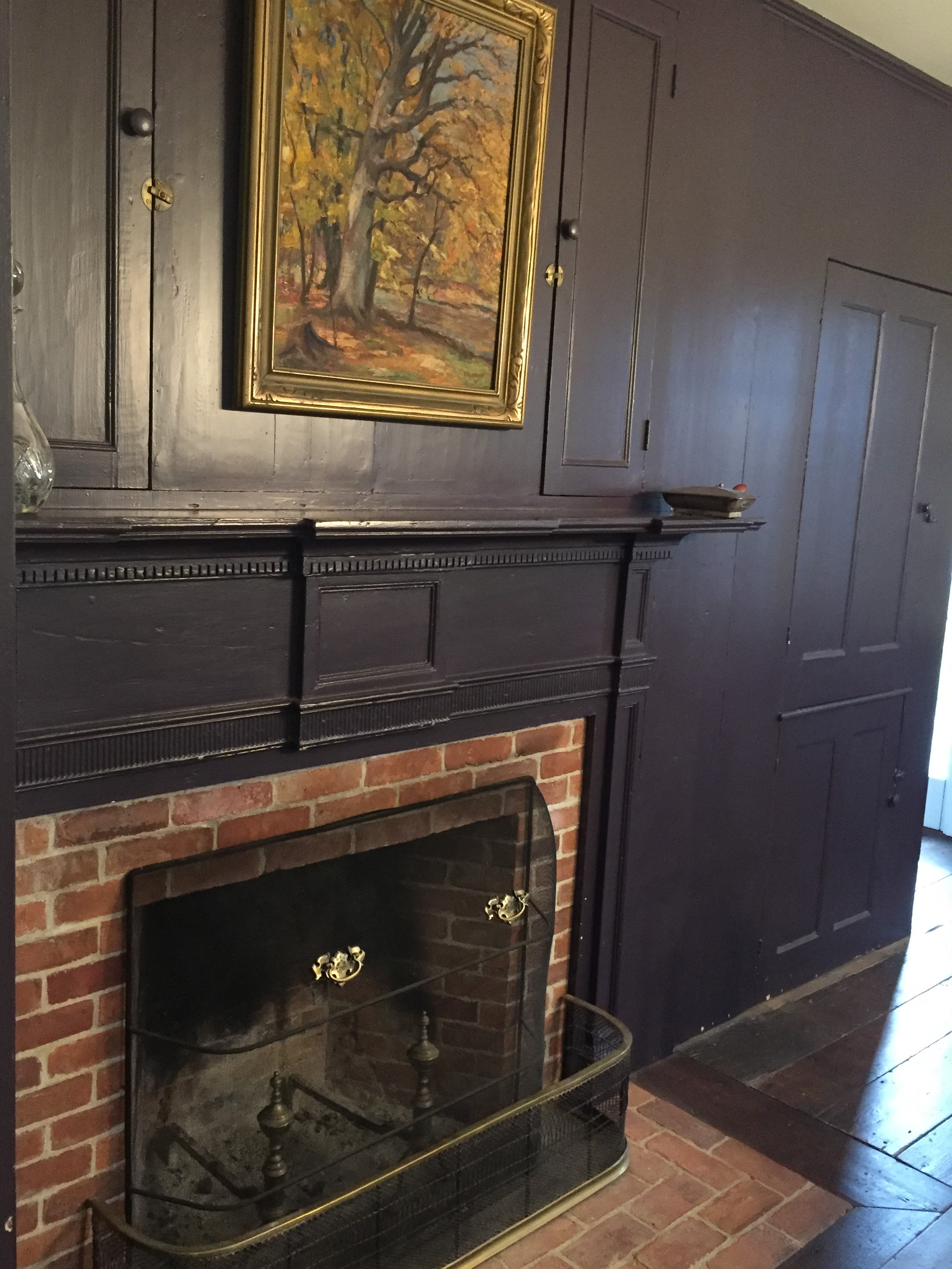 The paneling in this room dates back to the early 1800's. The pearl finish of the paint mutes the imperfections but doesn't eliminate them. It allows your imagination to wonder how those imperfections came to be. If allowed, the wood can reveal the secrets of the families that have lived here.