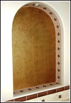 This stencil within the arch mimics a tile pattern