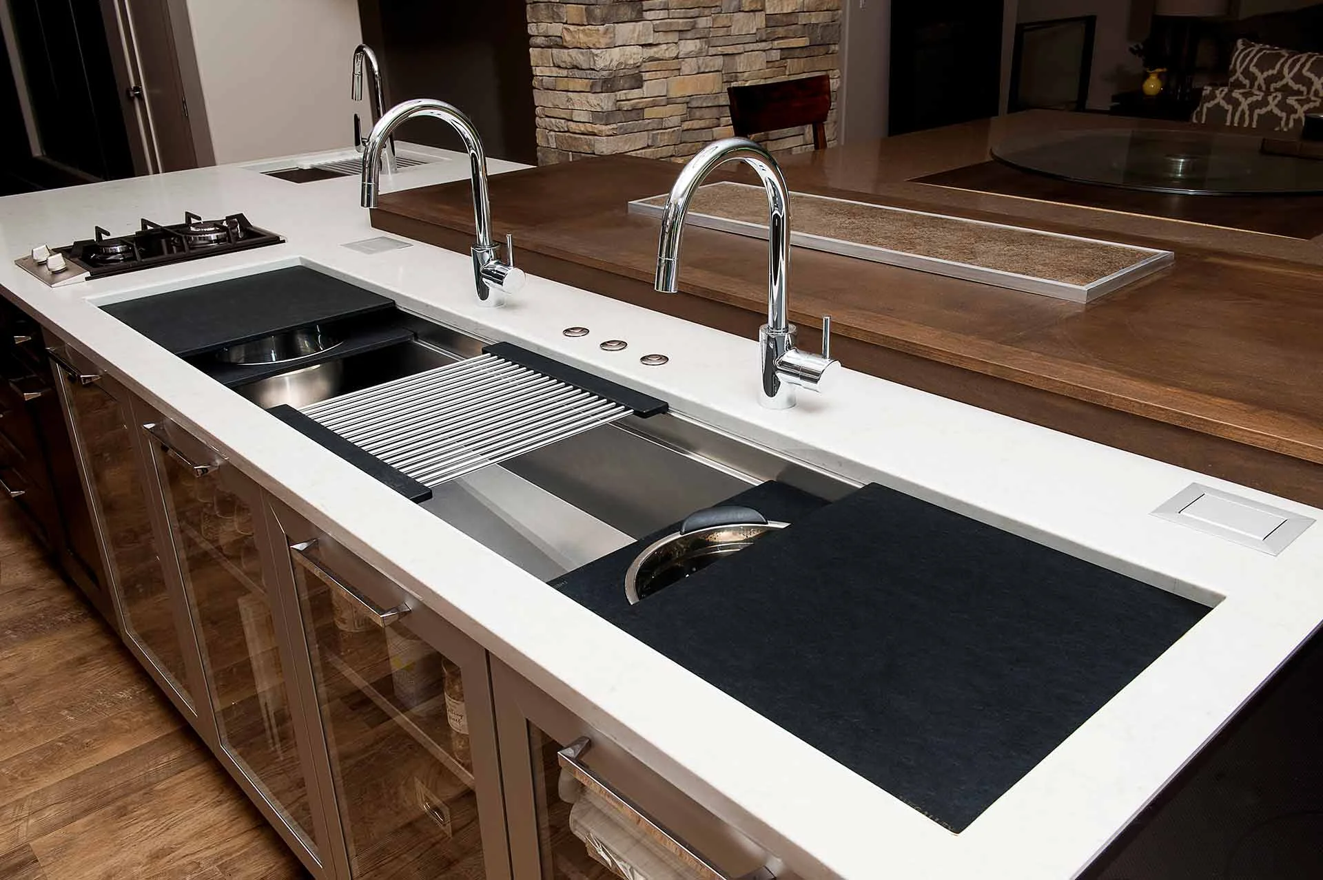 If a new sink is in your future, consider this workstation from The Galley. All stainless with cutting boards, drain racks and colanders that slide to make a perfectly functional and asthetically pleasign work area.