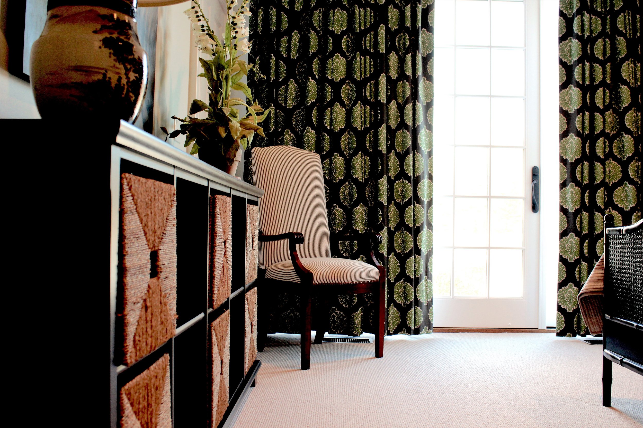 We played with scale, texture and colors in this bedroom. The grey and green colors contrast nicely, as do the cane bed and the rush baskets. 