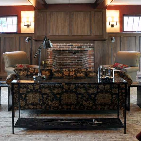 We were fortunate to work with a local craftsman, Dan Mosheim to design the black walnut paneling in this room. It creates a warm surround for the room and a nice backdrop for the brick fireplace. We continued the brick to the fireplace surround and hearth (sorry you can't see it) so we didn't detract from the beauty of the wood. 