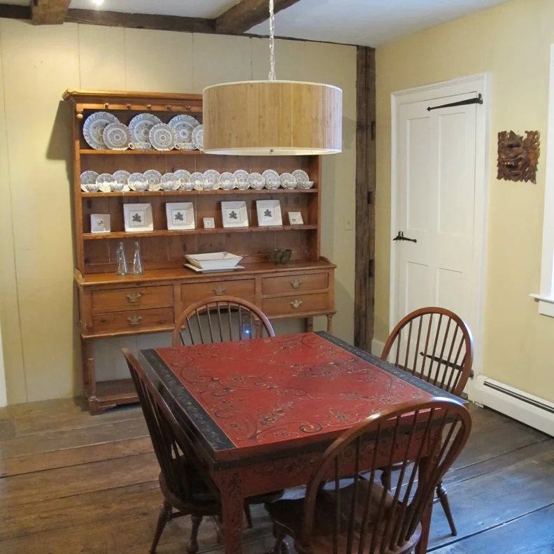 We have added a small dining table and have paired it with four dining chairs in the corner of our client’s living space.