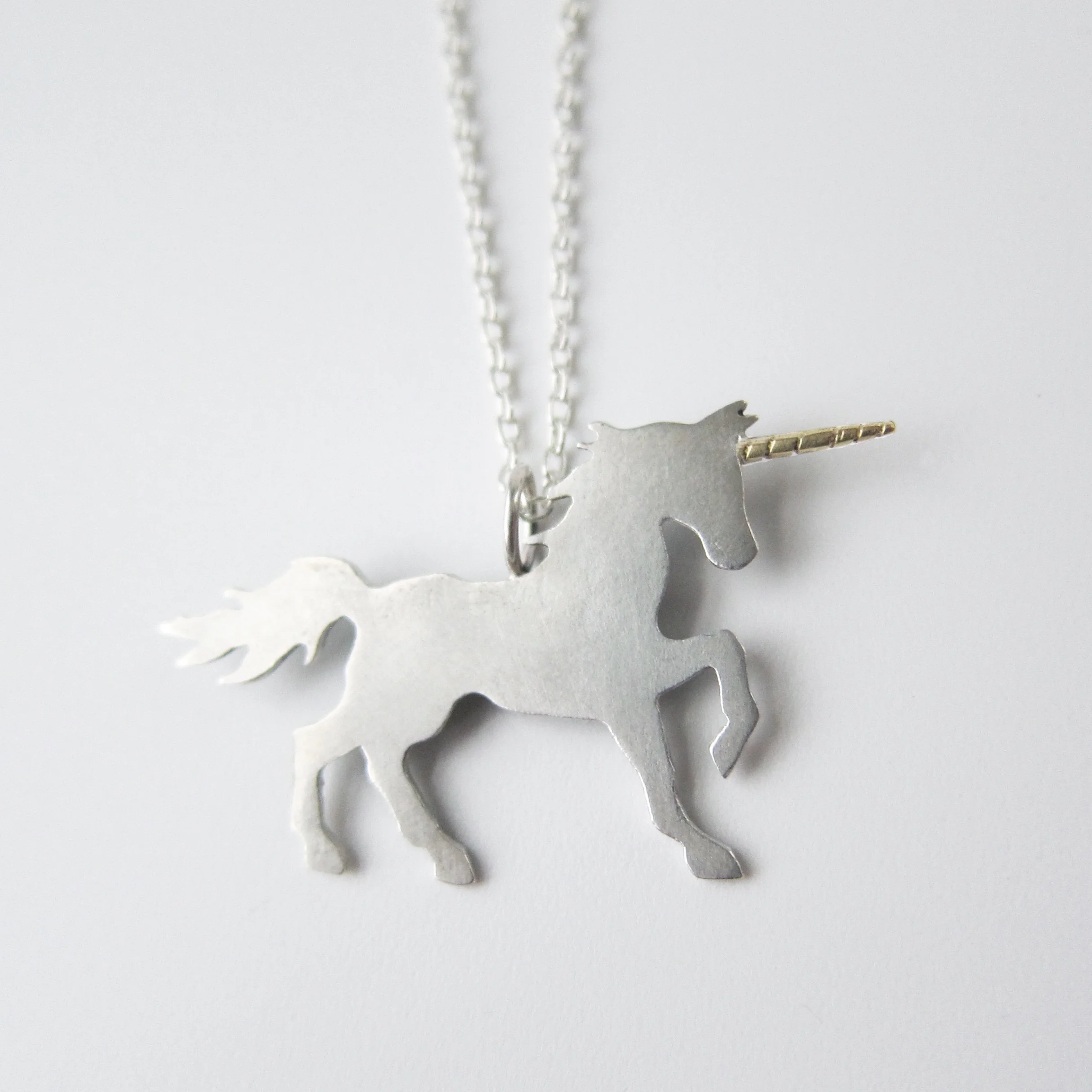 4. reversible unicorn, sterling with 18ky, front close up.jpg