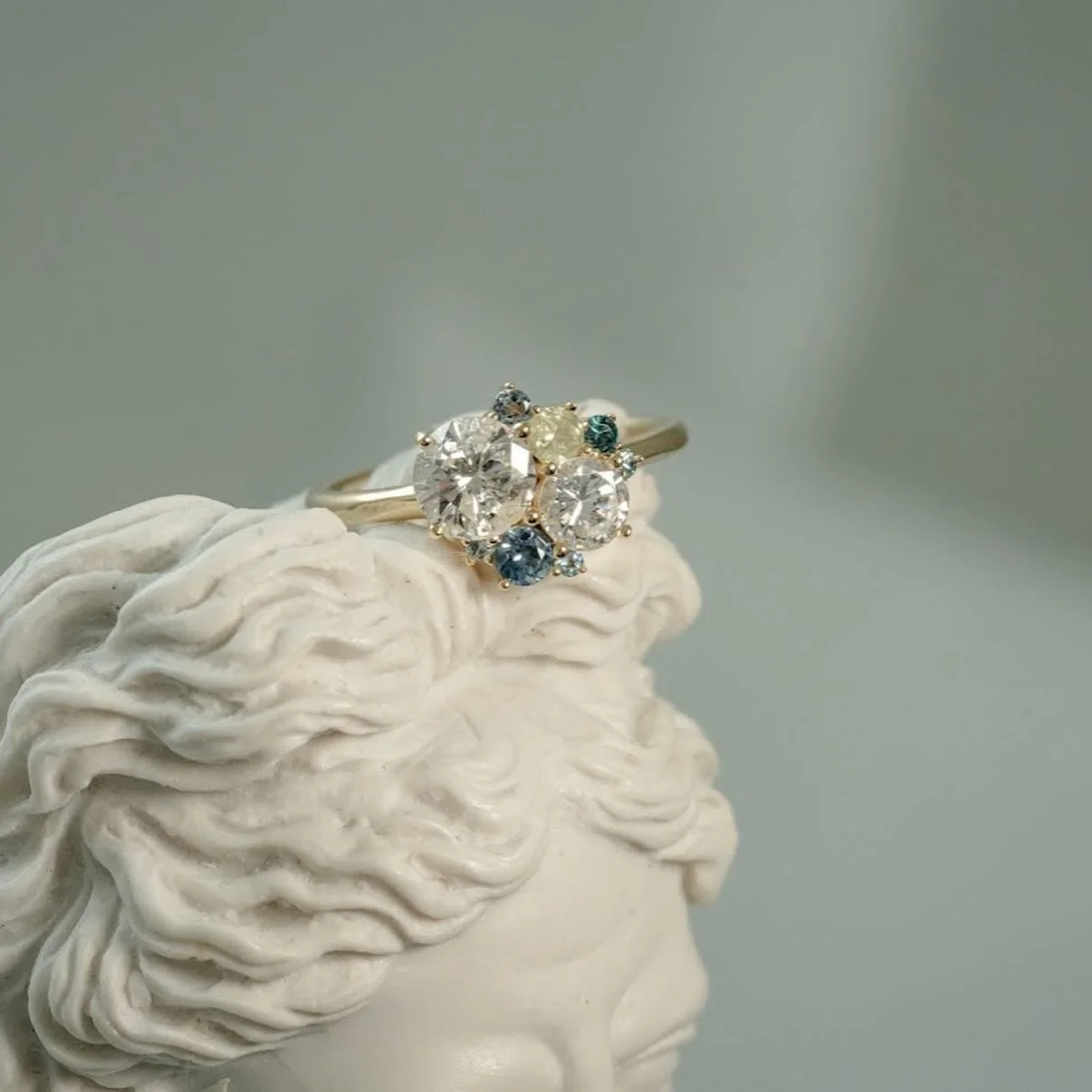 This heirloom redesign for Elizabeth 🤩🤩🤩
We created this arctic cool hue vibe with zircon, aquamarine, Montana sapphires, topaz, and her heirloom diamonds. 
My favorite part about a cluster design is that no two looks are the same. 🤍
.
.
.
.
📸: 