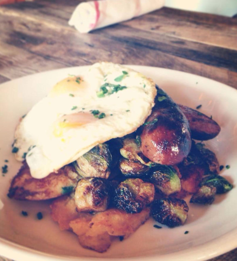  Source The Cajun Breakfast, poached eggs, andouille, crispy brussels, corn griddle cakes, sausage gravy $12