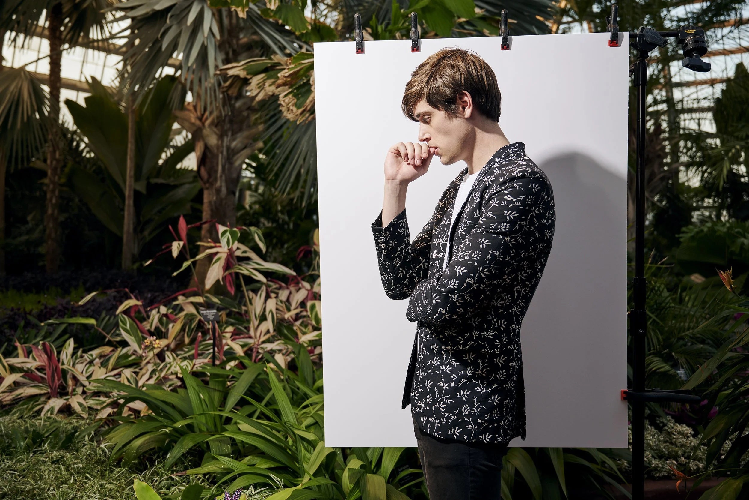 man wearing a sustainable floral blazer in black and white color