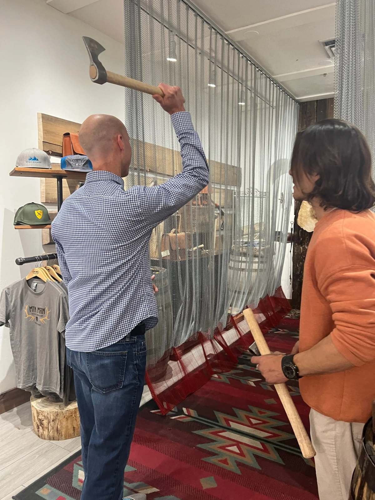 Team member throwing an axe during an axe-throwing activity