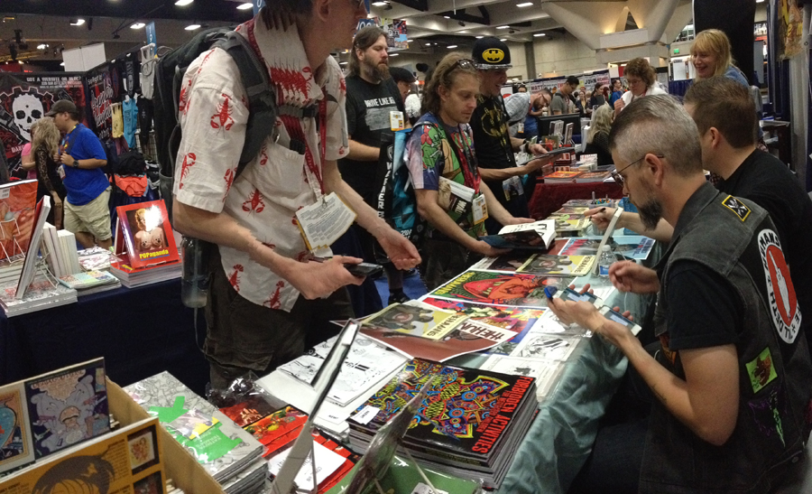 Signing at the Last Gasp booth