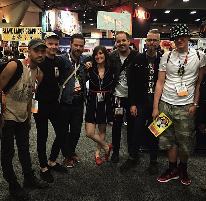 Always at the center of the party Jach Cohen made us pose at the Fantagraphics table. Left to Right: Michael DeForge, Patrick Kyle, Benjamin Marra, Jacq Cohen, KMK, Tom Neely, and Ed Piskor.
