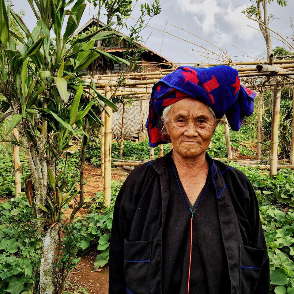 Nang Pwan, Nang meaning 'Miss' in Pa-O, stands in the same family garden she has tended for over seventy years.