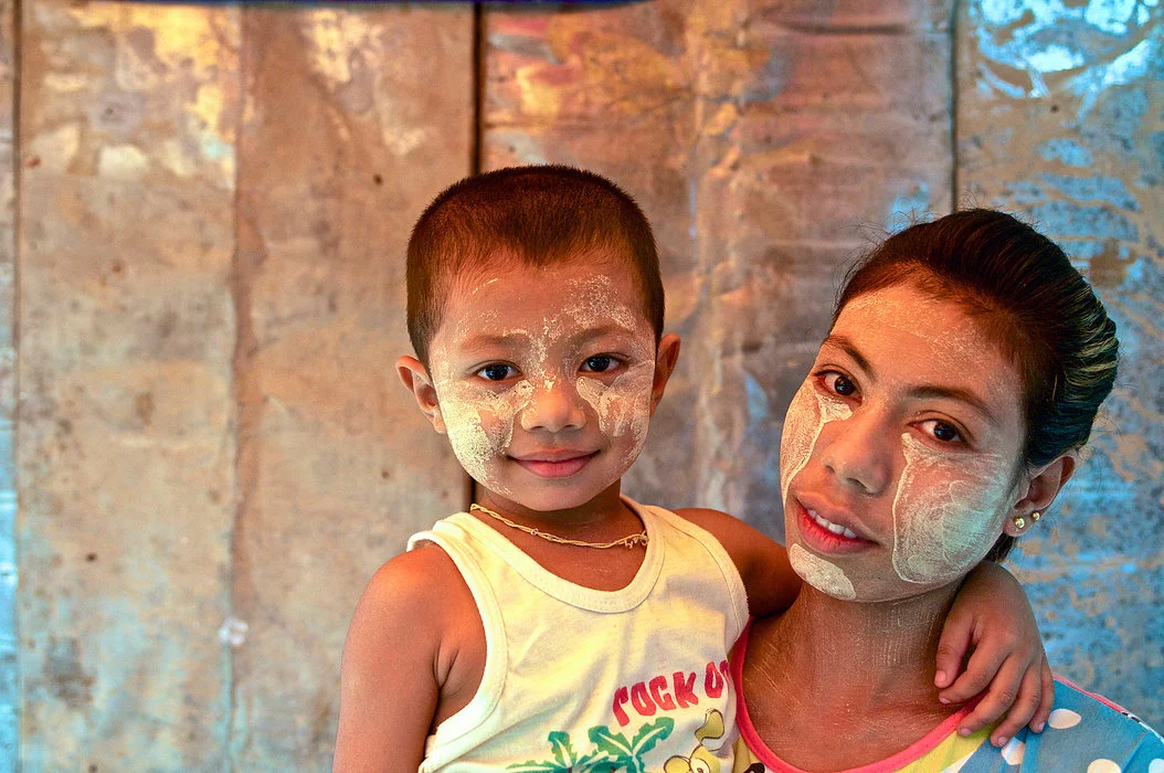 Like mother, like daughter. Tha Zin adorns her toddler with the same design because she believes it provides more complete sun protection. 