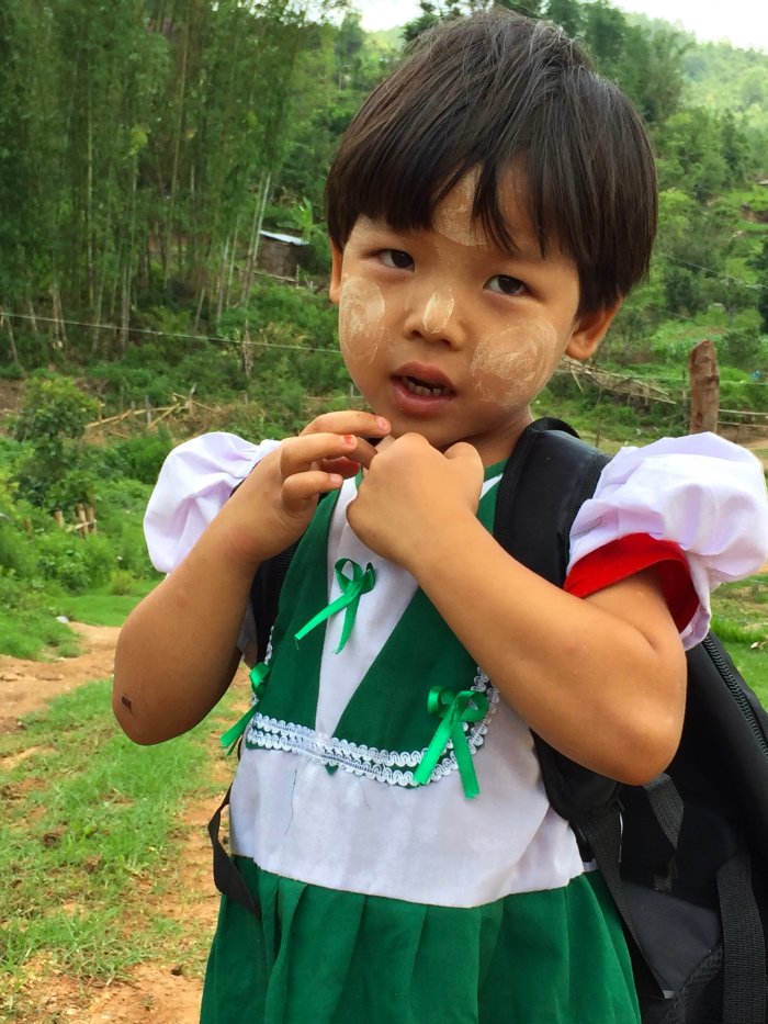 A Lahu girl walking home from school in eastern Shan State. The Lahu, like the Pa-O, have also begun to integrate Thanaka into their lives as a result of federal schooling.