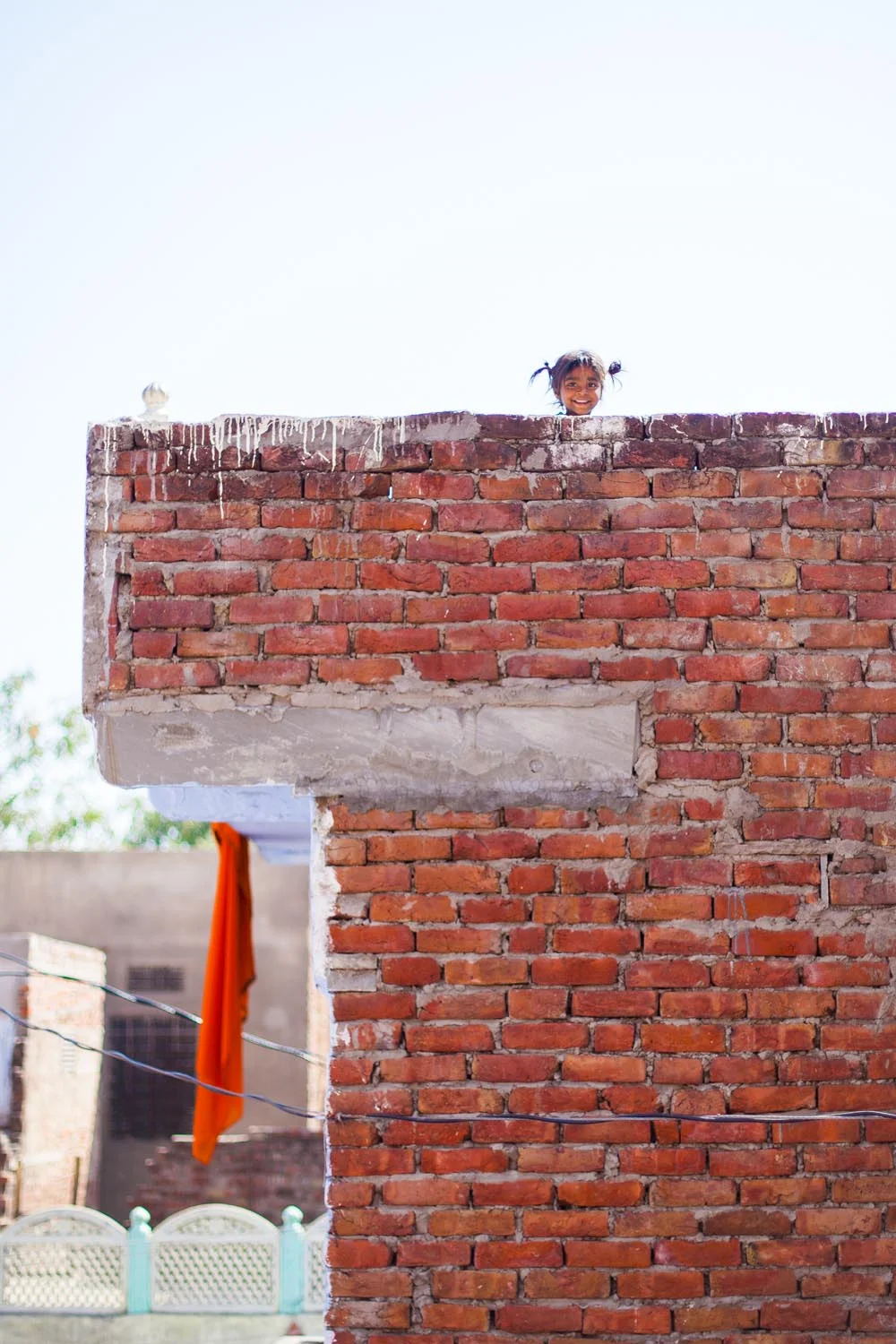  A little girl on her family's roof top during the Holi festival: Jaipur, India 