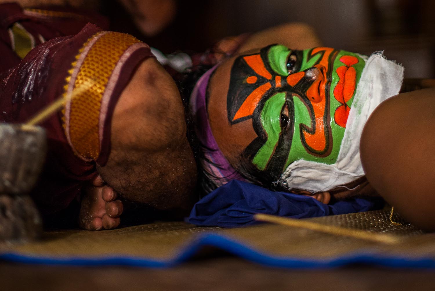  Kathakali performer getting his make up done. Kathakali is a Classical South Indian dance: Kochi, Kerala 