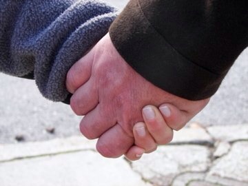 Holding Jeff's hand...