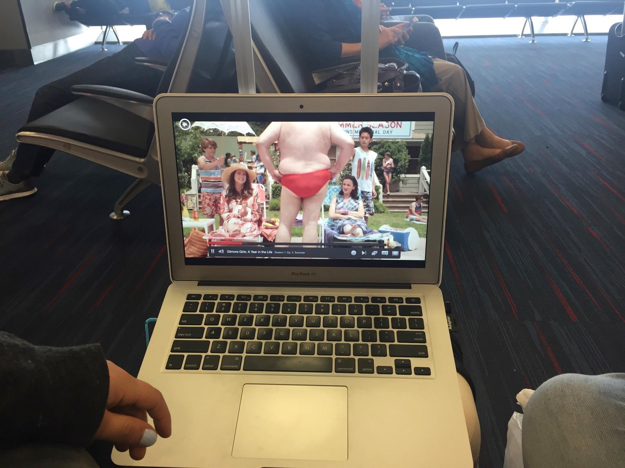 Waiting out our flight delay with an episode of Gilmore Girls.