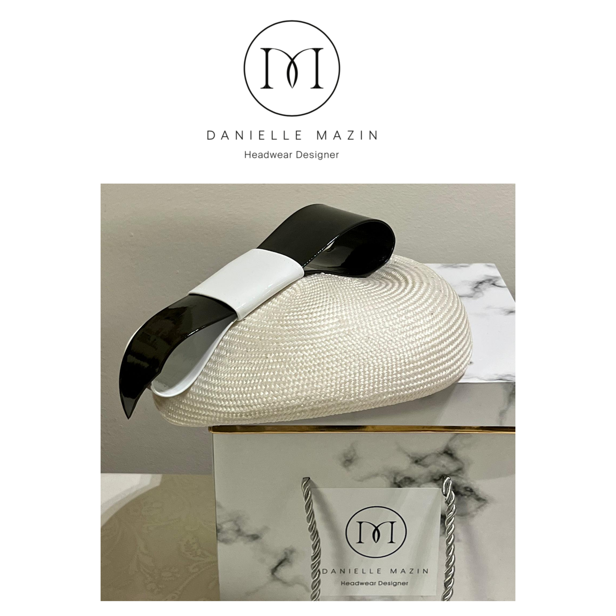 danielle mazin cream with black and white bow.PNG