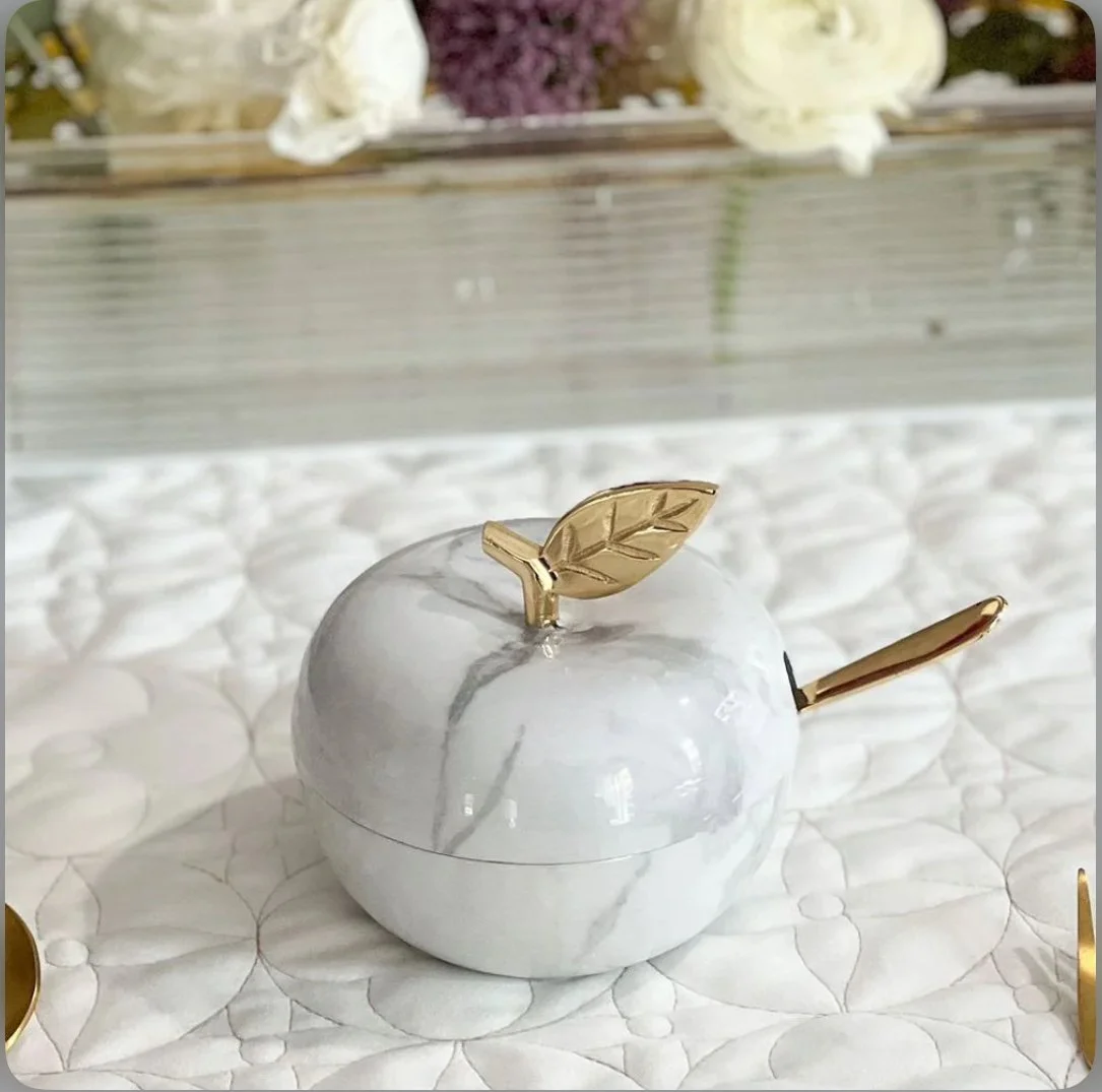 btshalom marble and gold honey dish tablescape.jpg