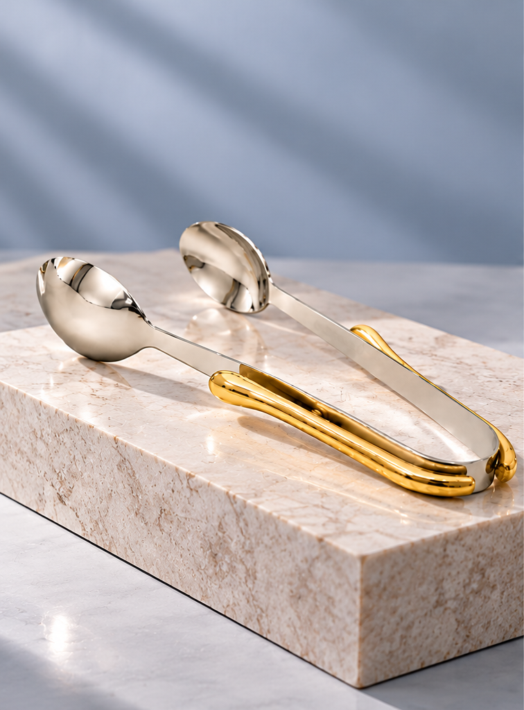 godinger tongs on pedestal.png