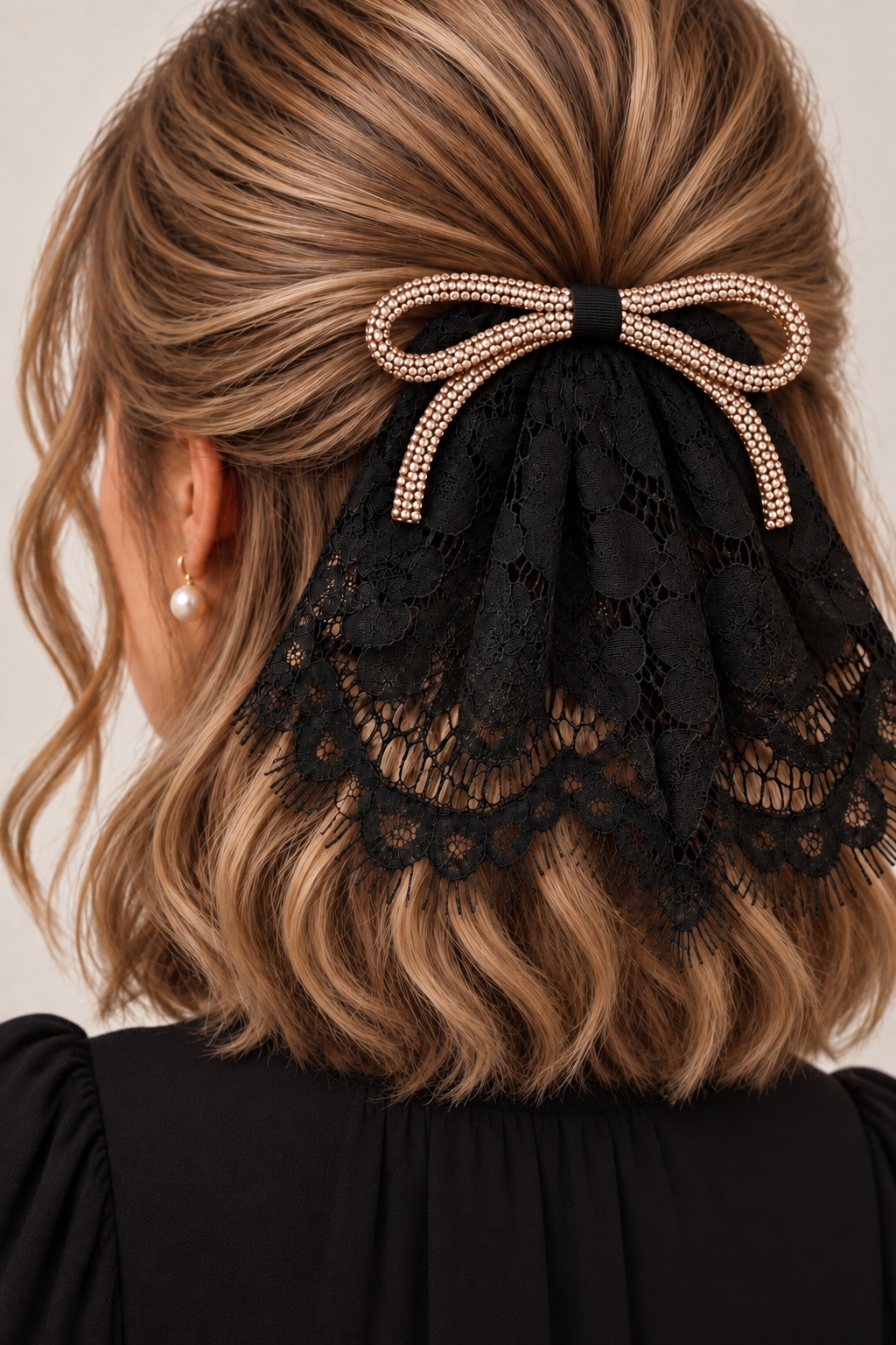carolina black eyelash with gold bow.png
