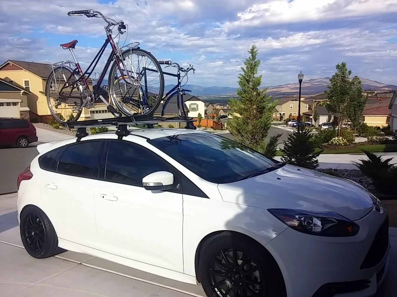 Ready for a bicycle adventure trip with our commuter bikes loaded on the roof of our car.