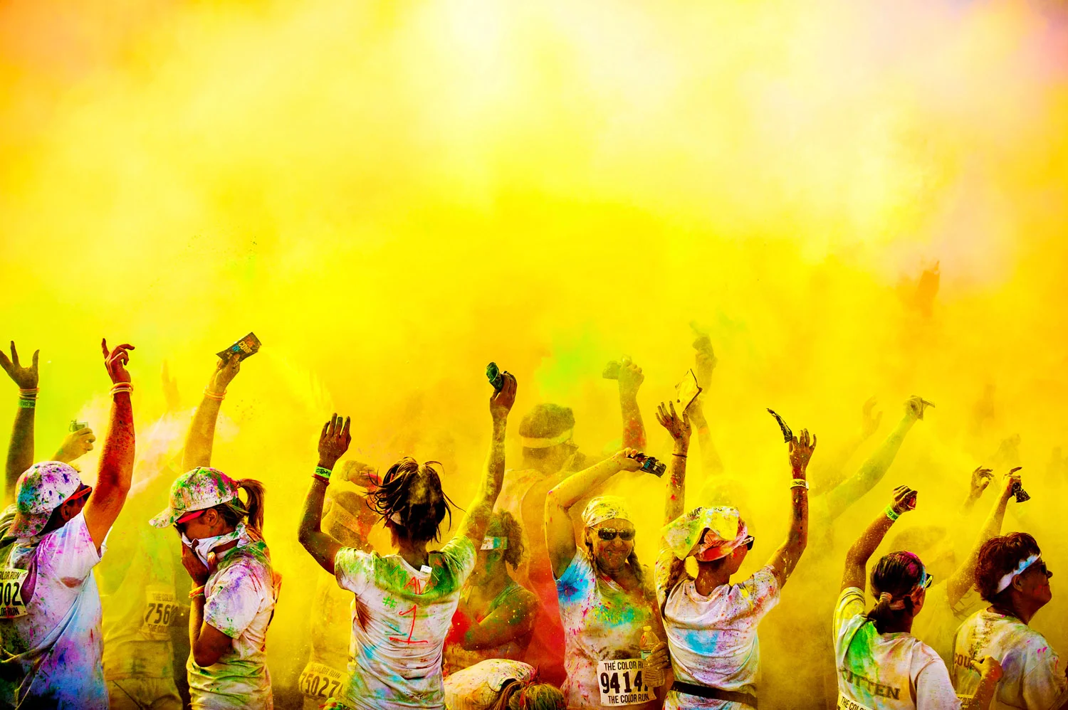 People dance at the Colorado Springs color run
