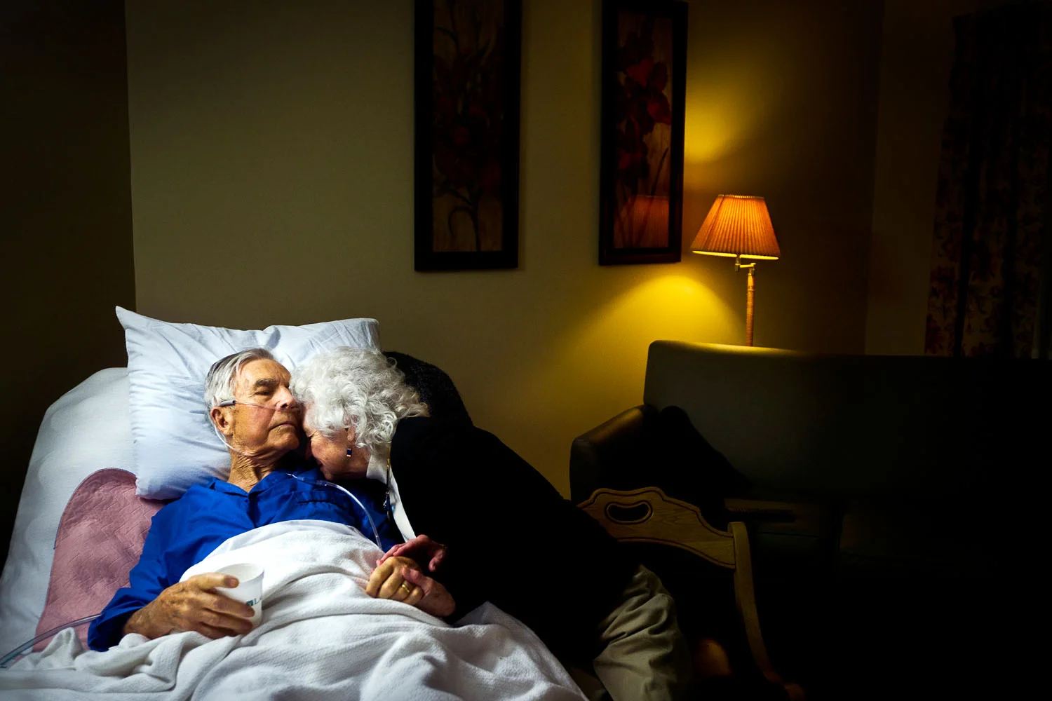 Man lies in hospital bed as he dies from cancer