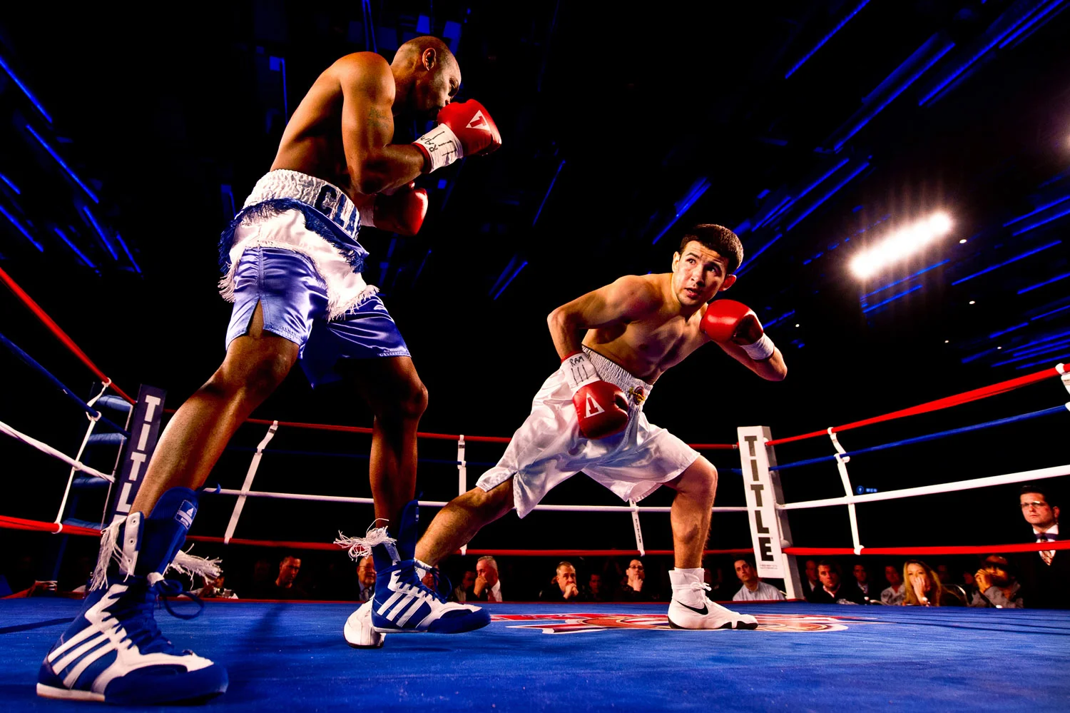 Men fight during a boxing match