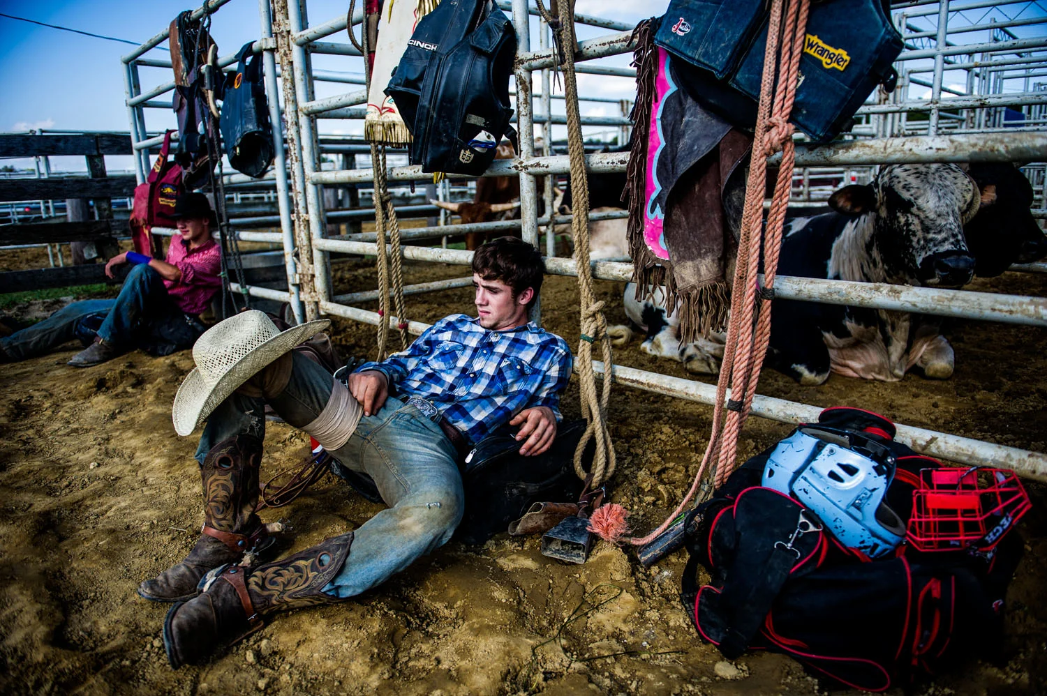 Cowboy rests after competing at the rodeo
