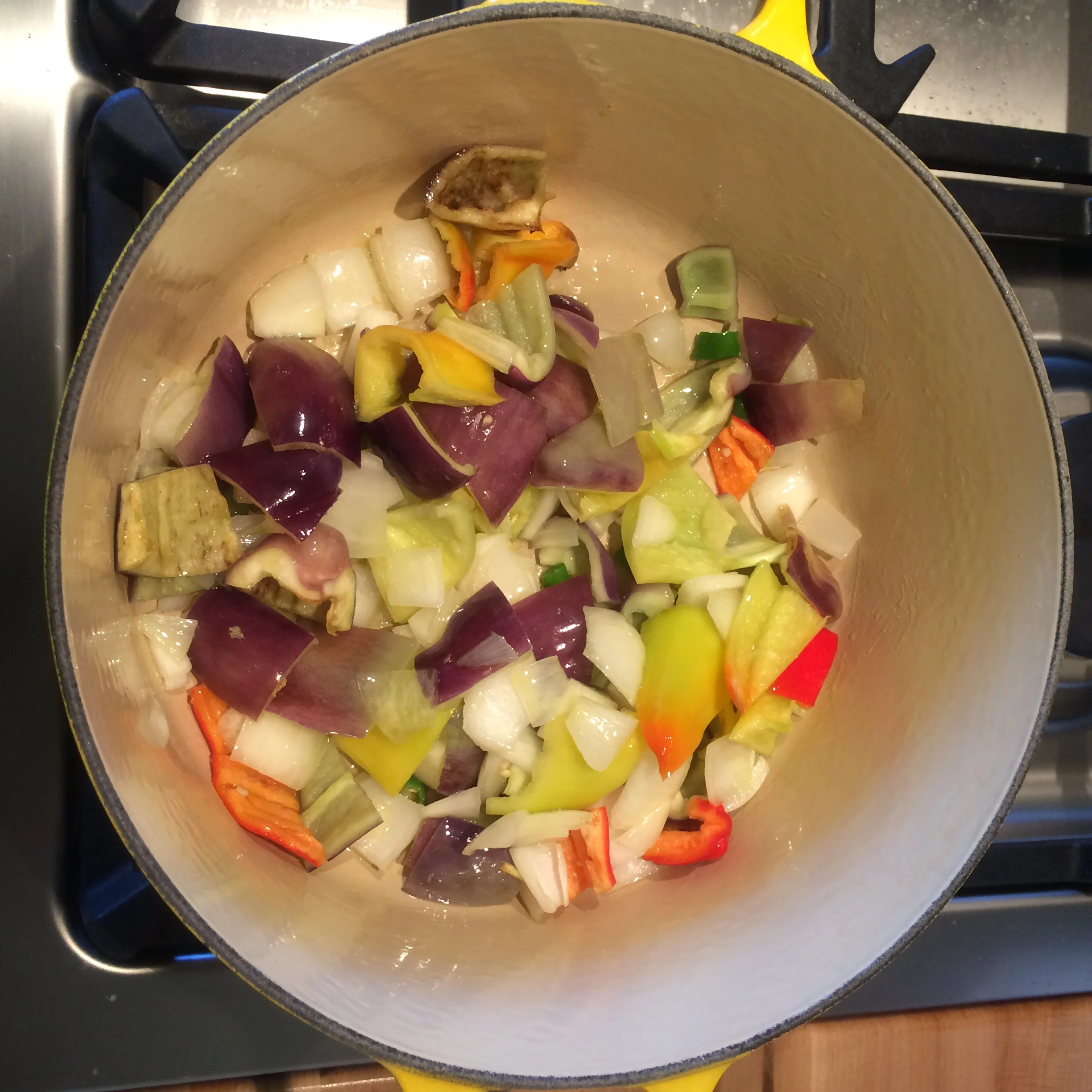 Rough chop your sweet peppers, chilis and onion. Saute on medium-low heat for 5 minutes in 2 tablespoons of olive oil.