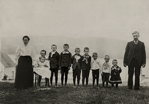 An informal group portrait of a family with nine sons in Nova Scotia