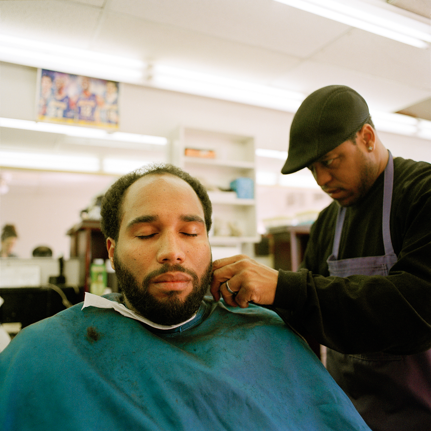   Isaac used to cut hair in the neighborhood, then he opened up his own shop, Los Angeles  2013 