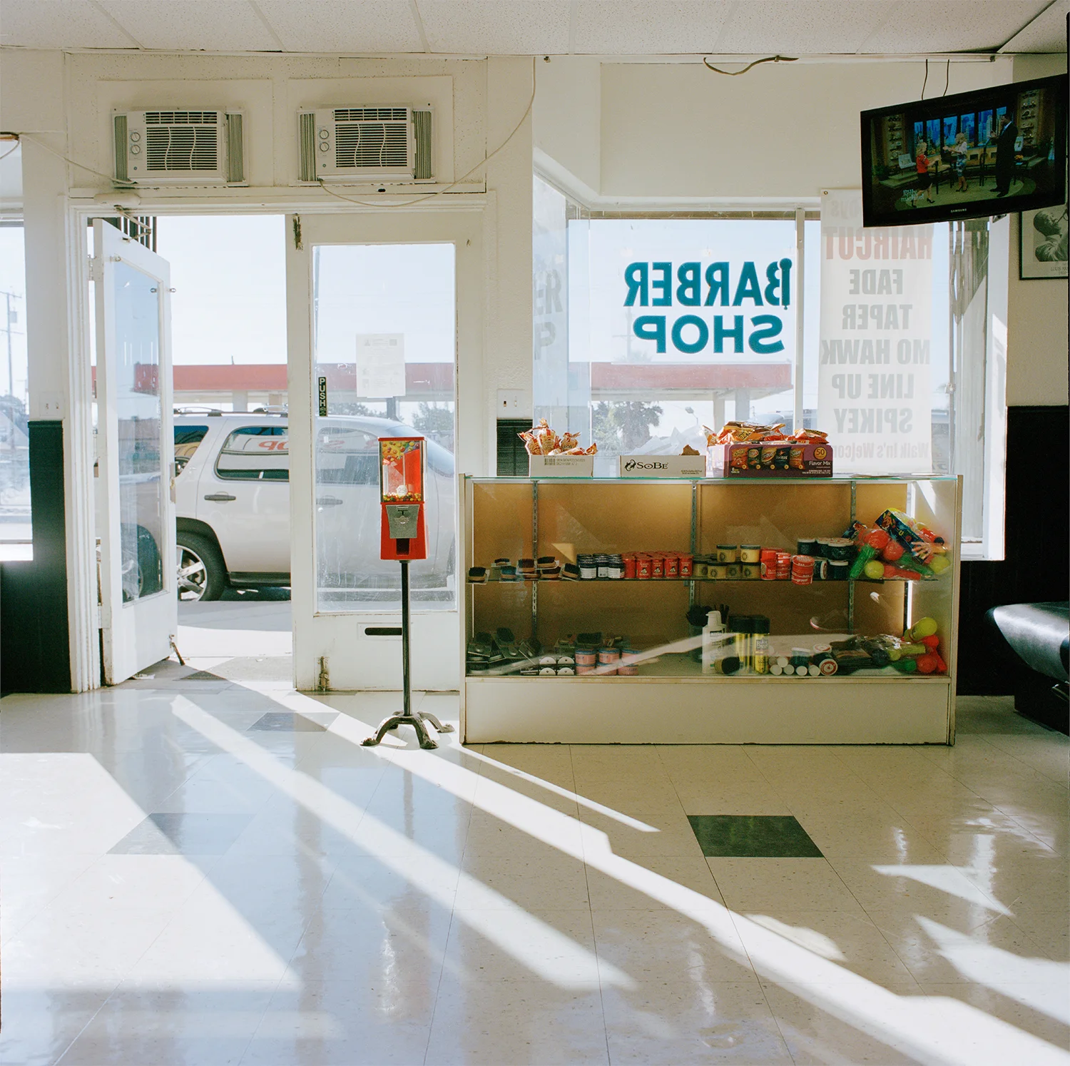 Chuck used to own a TV repair shop, now he rents to a barber shop, Los Angeles 2013