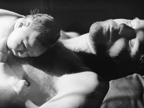 Anya at four days old sunning with me in the front room of the house.