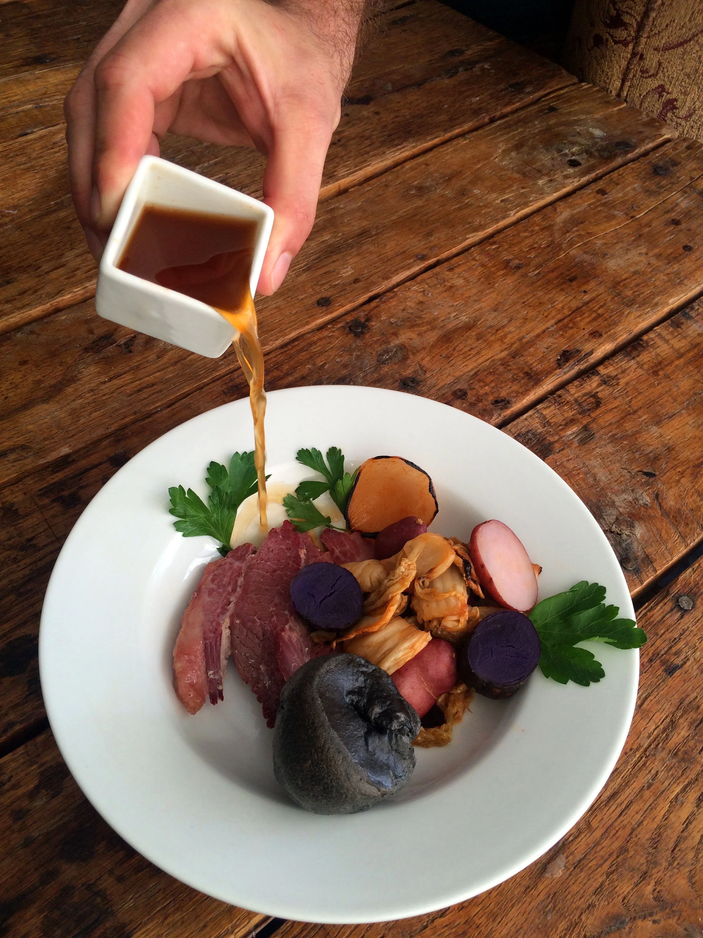 Corned Beef & Kimchi Potatoes Steamed in Kombu, Ramen Bone Broth, Squid Ink Yorkshire Pudding