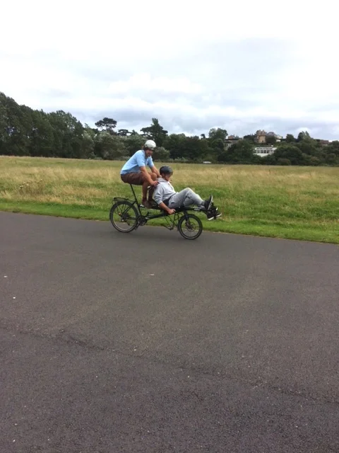 Chris test-riding a recumbent tandem. He loved the feeling of speed and was surprised just how fast it felt.