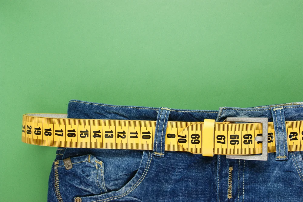 Weight loss tape measure jeans shutterstock_164062430.jpg