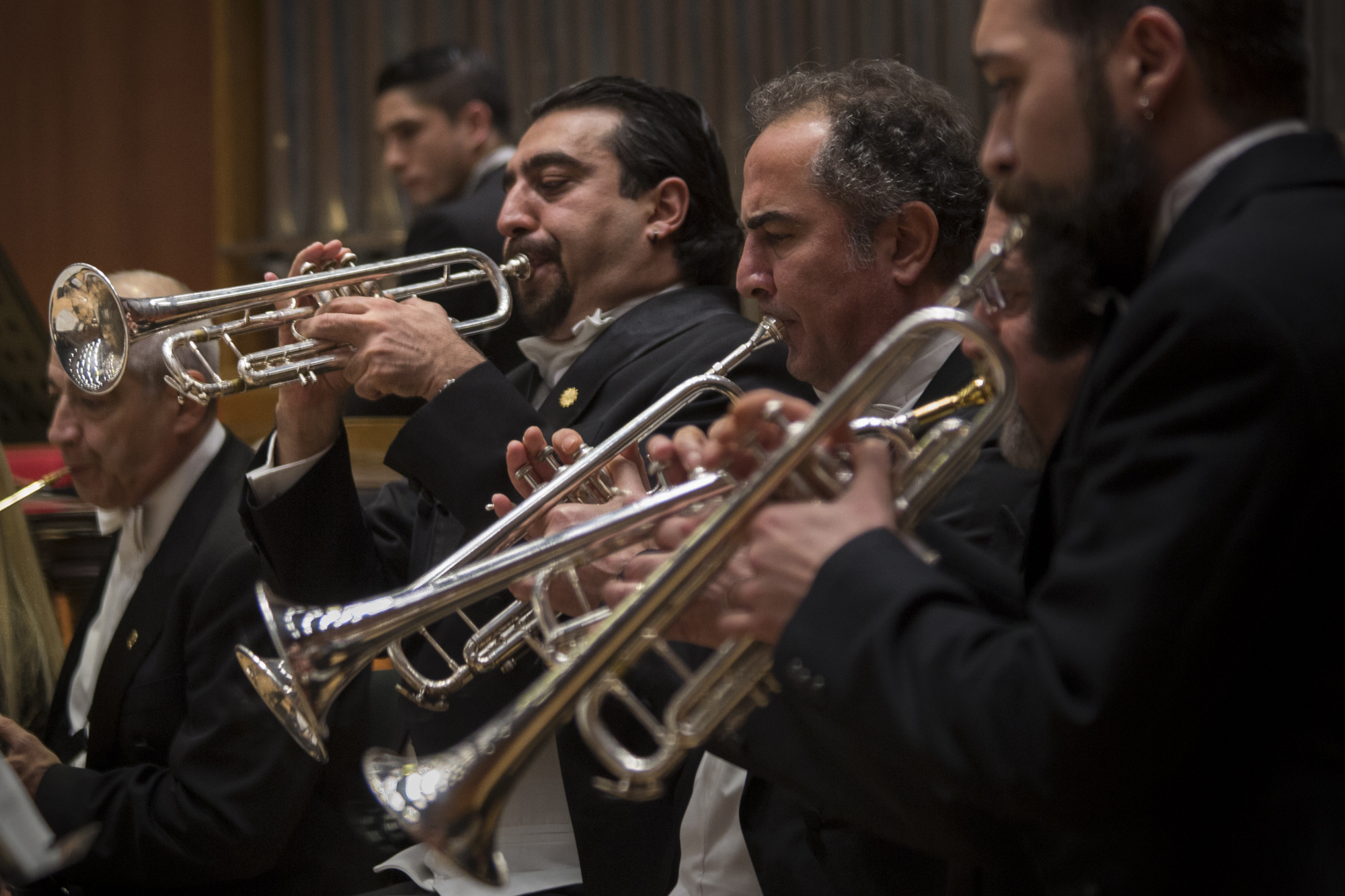 Cem a musician member of the CSO’s administrative team and fellow trumpeters perform during a weekly concert. Many of the CSO musicians have multiple jobs for financial reasons. Ankara, 18th of December 2014.