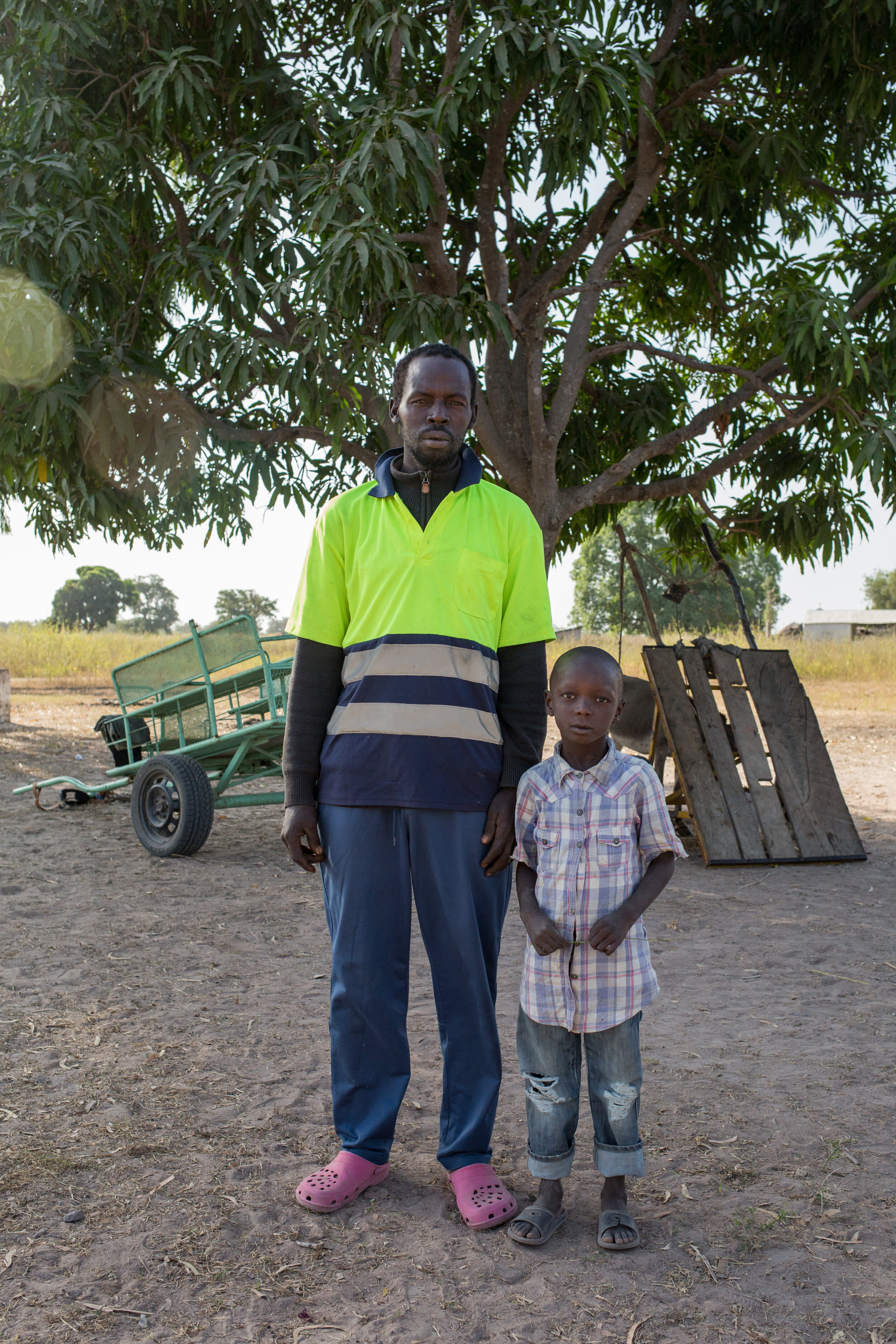  Ali and his son Musa. Behind is the new cart (left), and the old the cart, which Ali drives.   