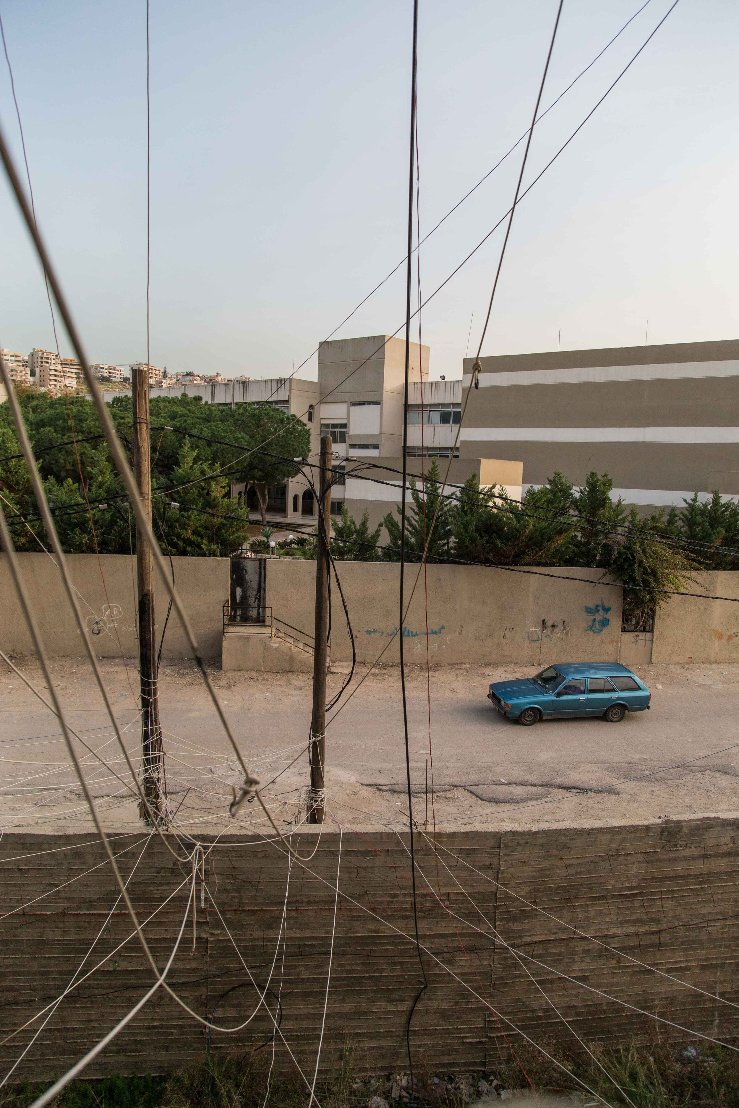  In the refugee camp of Ouzai, West Lebanon, residents rely on tapped electricity due to the lack of help from the private school nearby. 