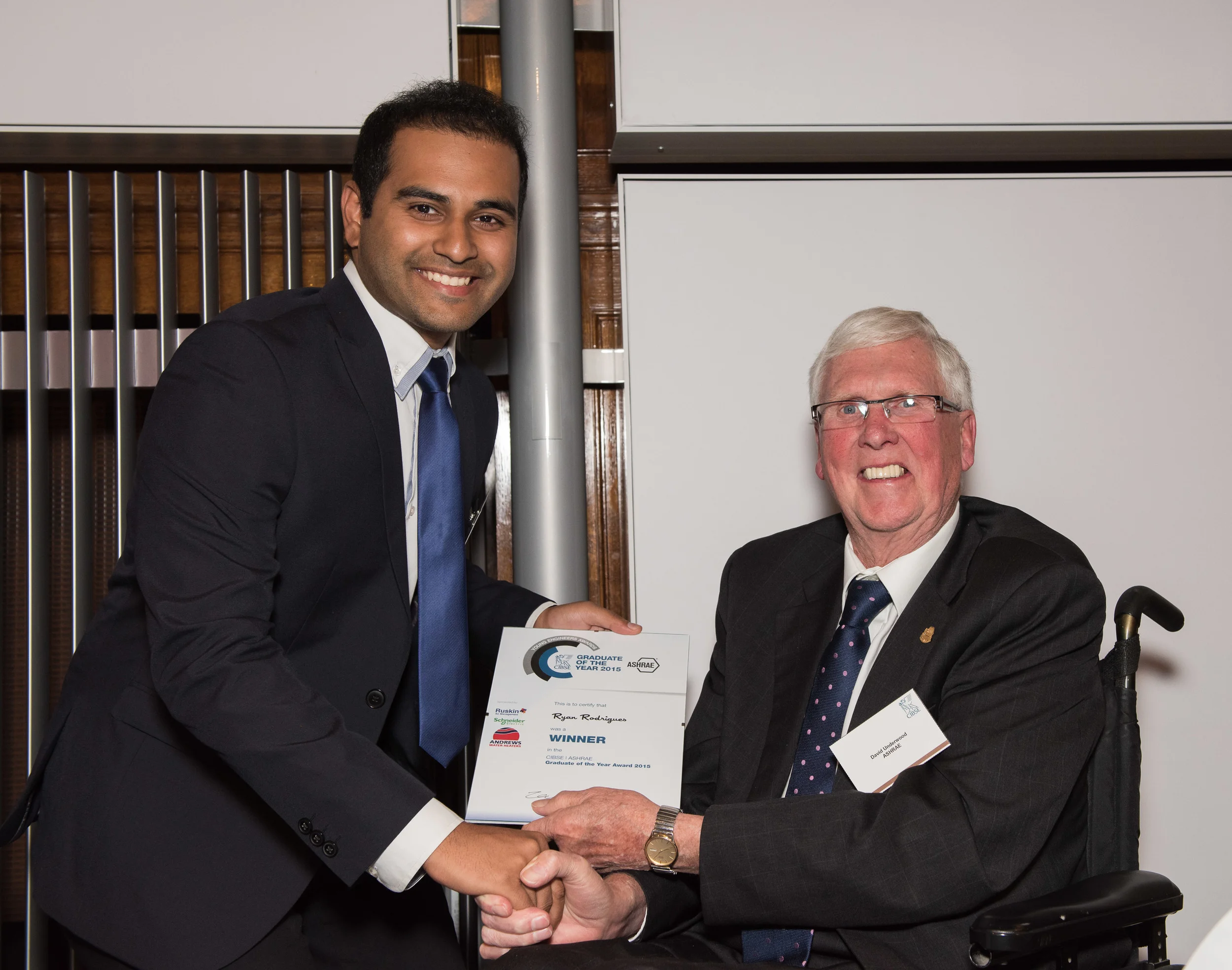 Ryan Rodrigues receives award from ASHRAE president.