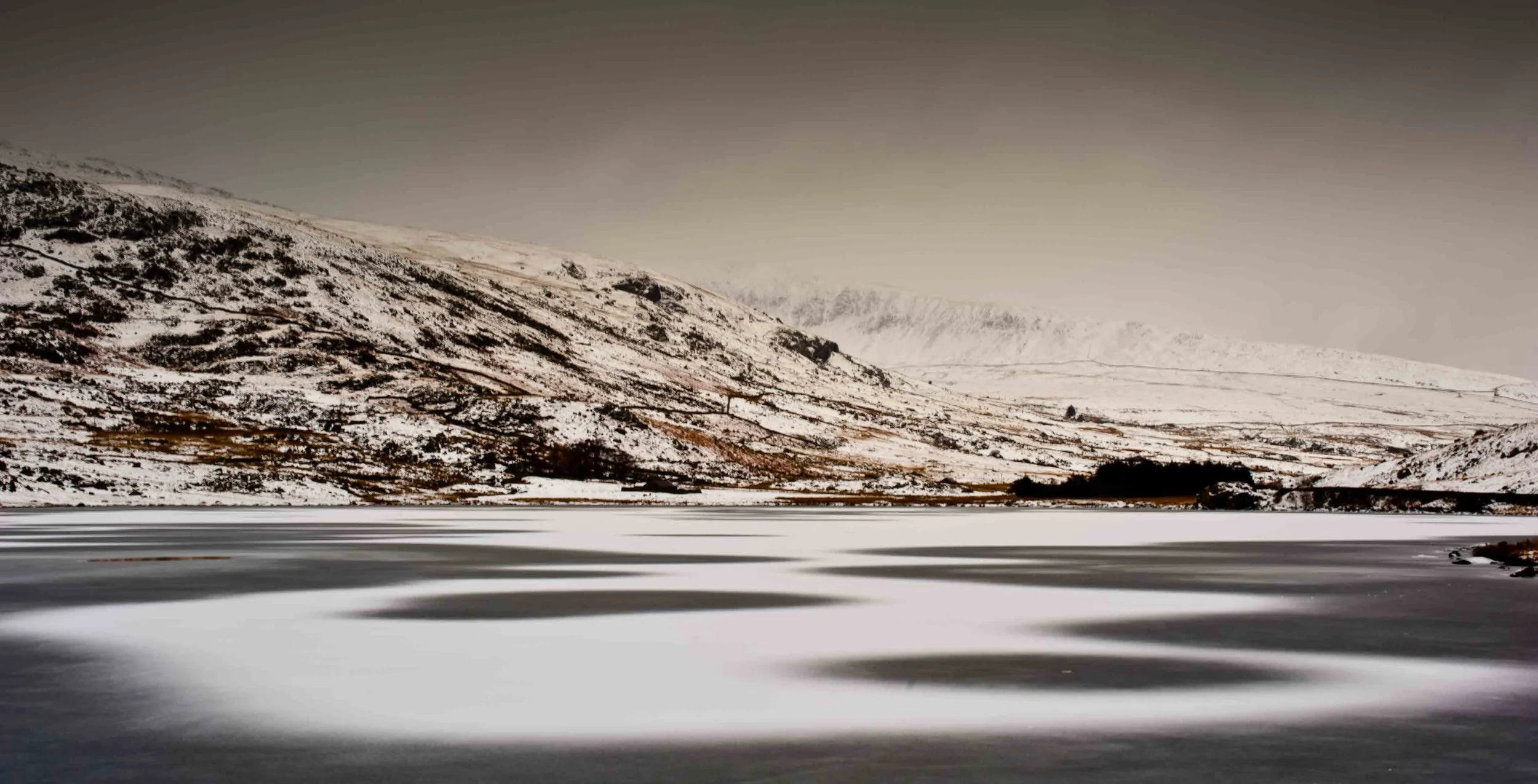 Llyn Ogwen swirling snow 