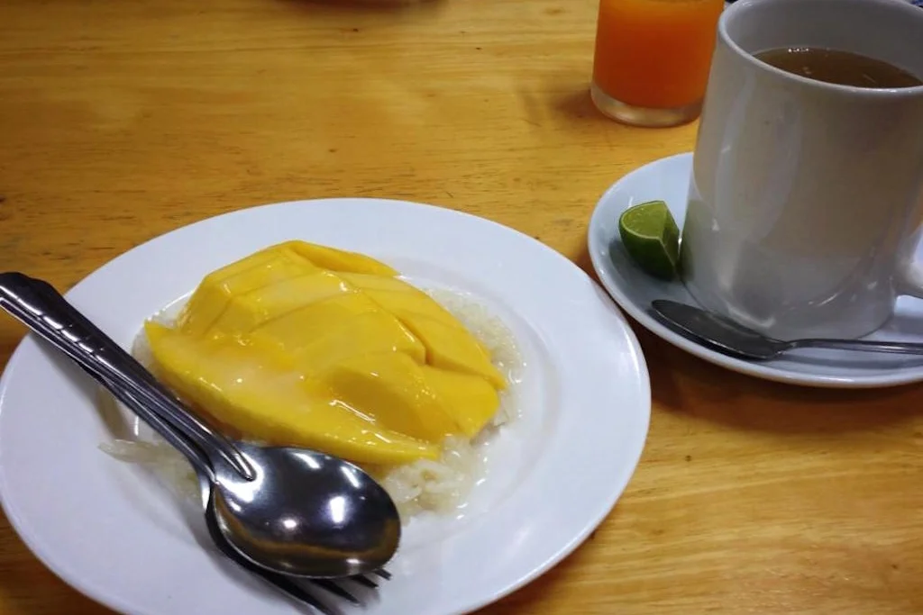 Coconut sticky rice with sliced mango. Plus, the infamous ginger tea.